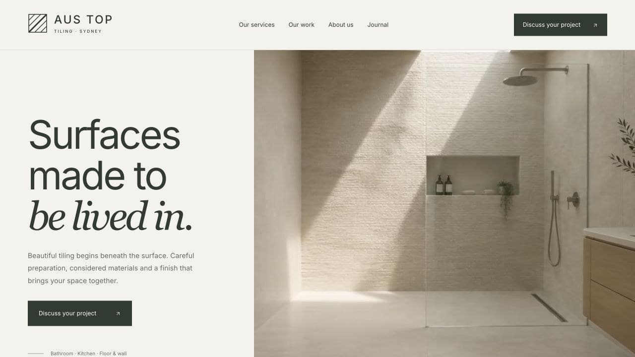 The AUS TOP Tiling homepage with a tiled bathroom.